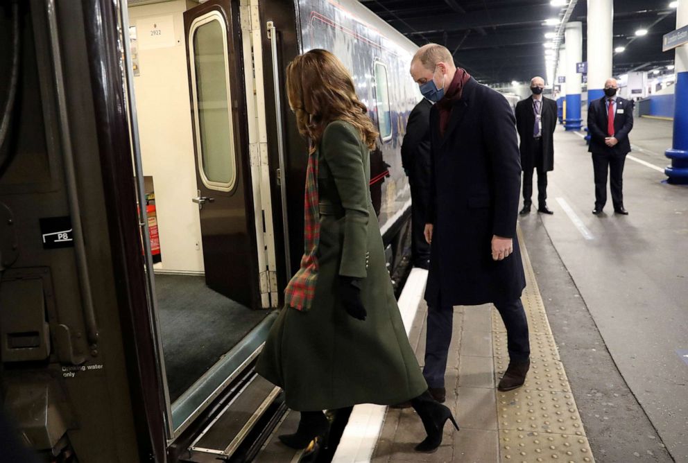 PHOTO: Britain's Prince William and Catherine, Duchess of Cambridge, board the Royal train at London Euston Station.