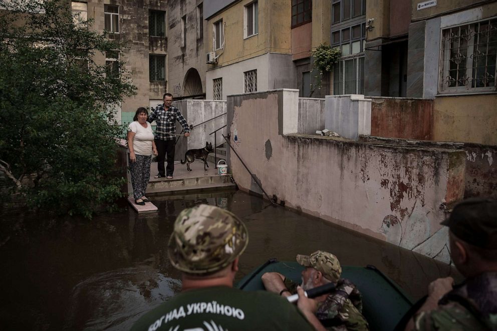 PHOTO: Military chaplains talk to residents stranded in a flooded neighborhood in Kherson, Ukraine, June 7, 2023.