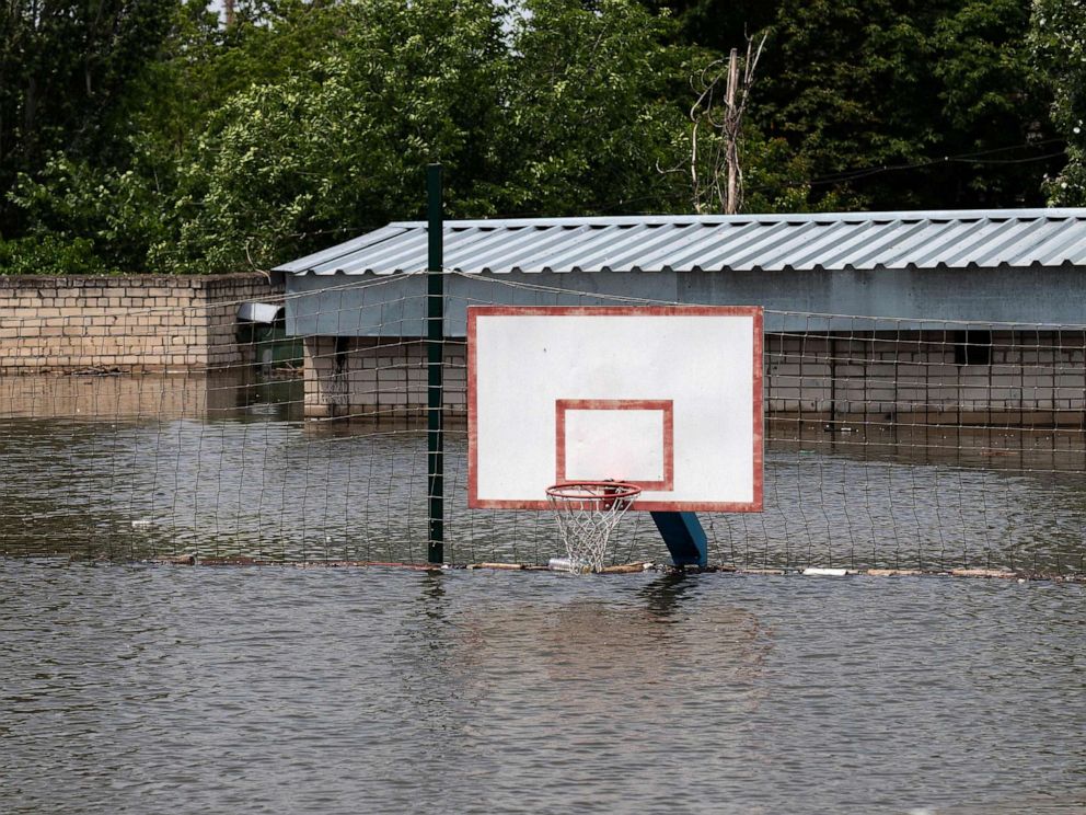 PHOTO: This general view shows a submerged basketball court in Kherson on June 8, 2023, after floodwaters engulfed the city following damage sustained at Kakhovka hydroelectric power plant dam.