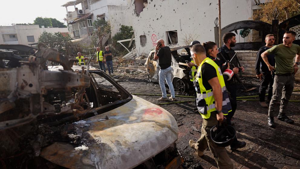 PHOTO: Israeli security forces examine a site hit by a rocket fired from Lebanon, in Kiryat Bialik, northern Israel, on Sunday, Sept. 22, 2024.