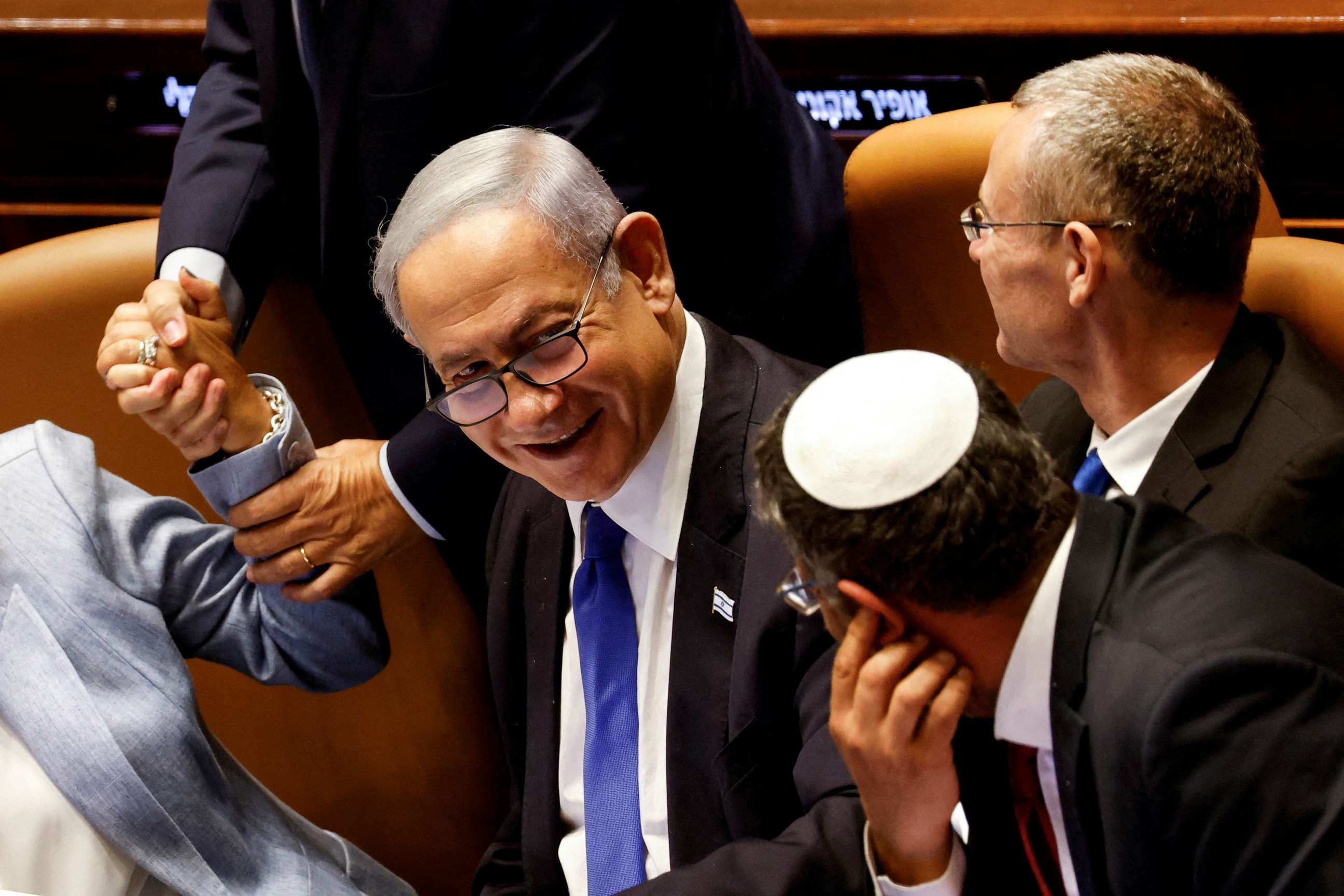 PHOTO: Israeli Prime Minister Benjamin Netanyahu and lawmakers gather at the Knesset plenum to vote on a bill that would limit some Supreme Court power, in Jerusalem, July 24, 2023.