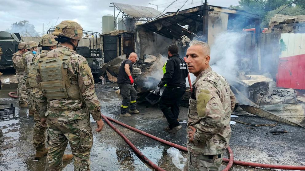 PHOTO: Soldiers and rescuers gather at the scene of an Israeli airstrike that targeted a Lebanese Army post in Al-Amiriya in southern Lebanon on Nov. 24, 2024.