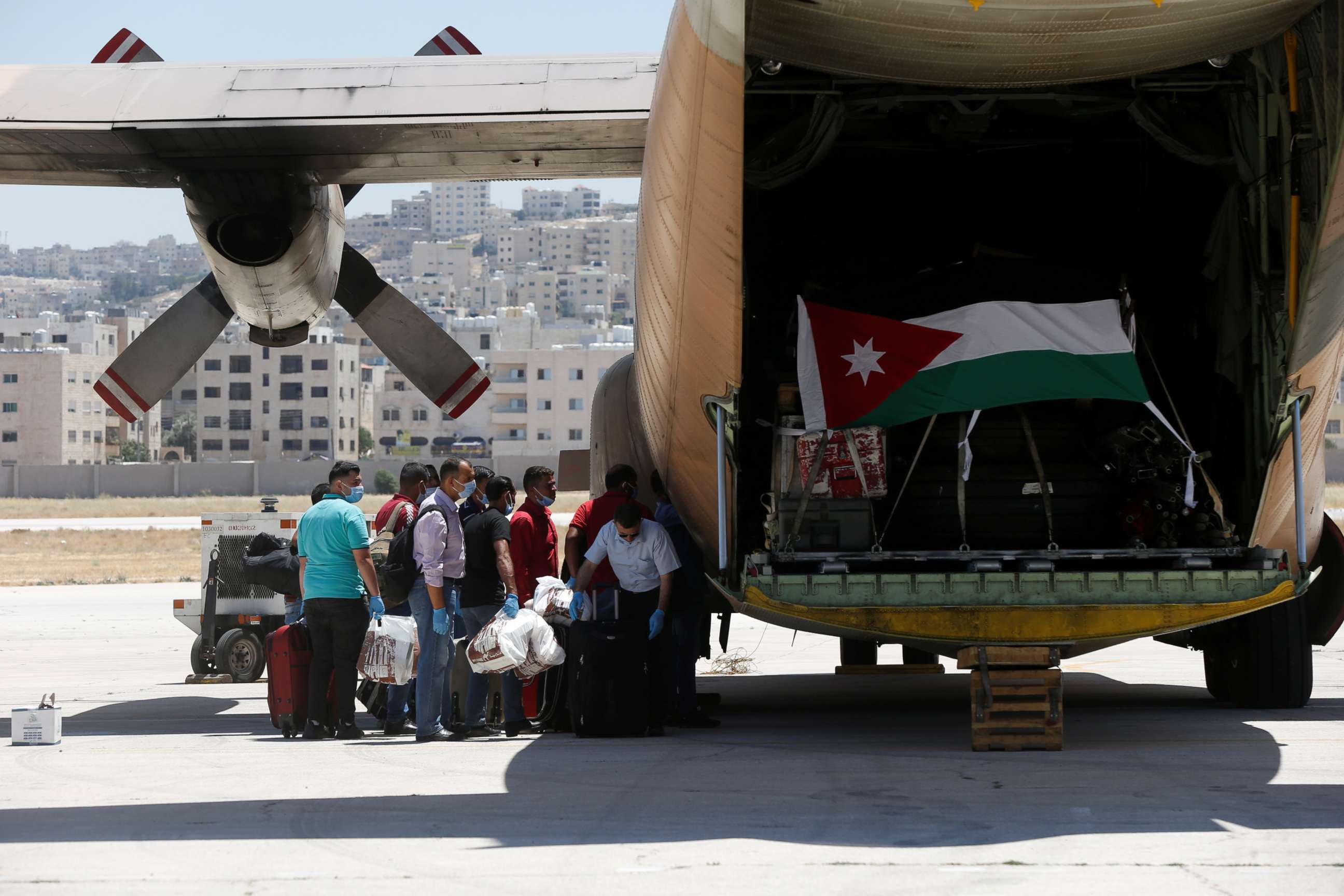 PHOTO: Members of the Jordanian Military Field Hospital prepare to board the plane as they head to Beirut to provide medical support following Tuesday's blast, at Marka Military Airport, in Amman, Jordan August 6, 2020. 