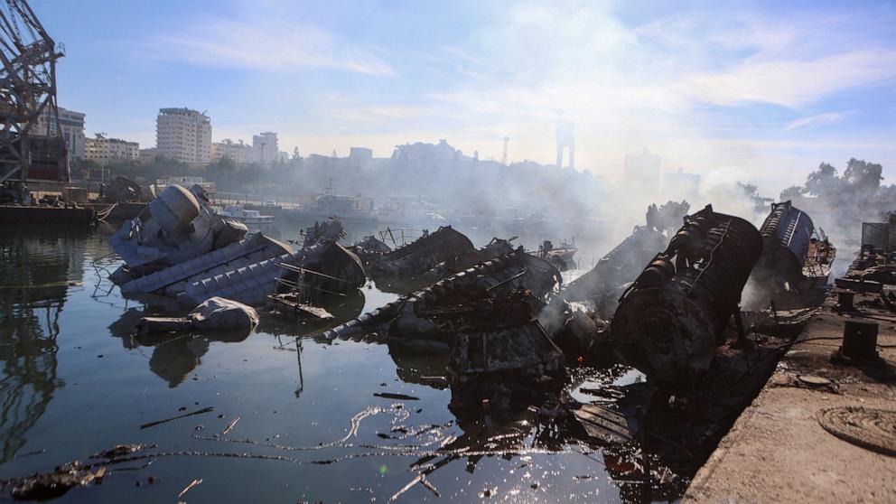 PHOTO: Smoke billows from Syrian naval ships destroyed in an overnight Israeli attack on the port city of Latakia on Dec. 10, 2024.