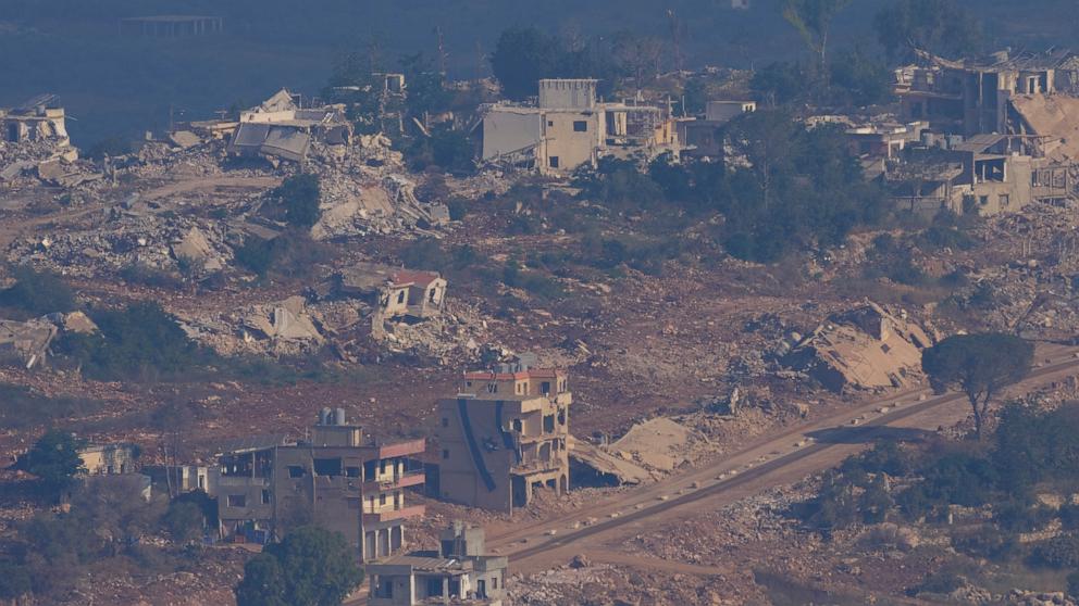 PHOTO: An Israeli flag, center, on a destroyed building in southern Lebanon is seen from northern Israel.