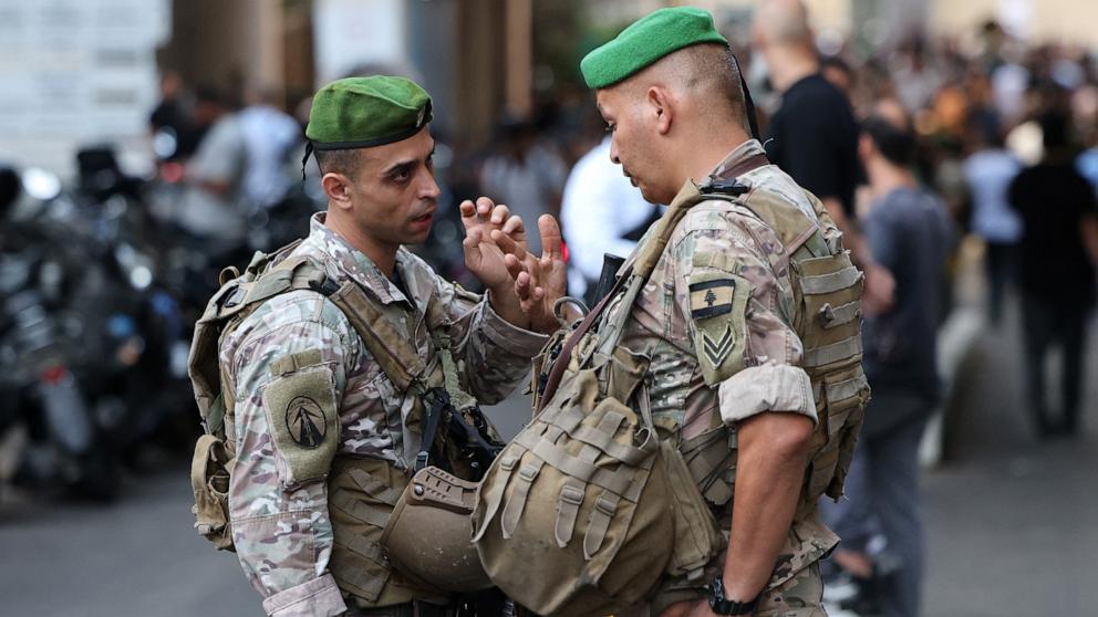 Lebanese army soldiers stand guard at the entrance of a hospital (background) in Beirut on September 17, 2024. (Photo by Anwar AMRO / AFP) (Photo by ANWAR AMRO/AFP via Getty Images)