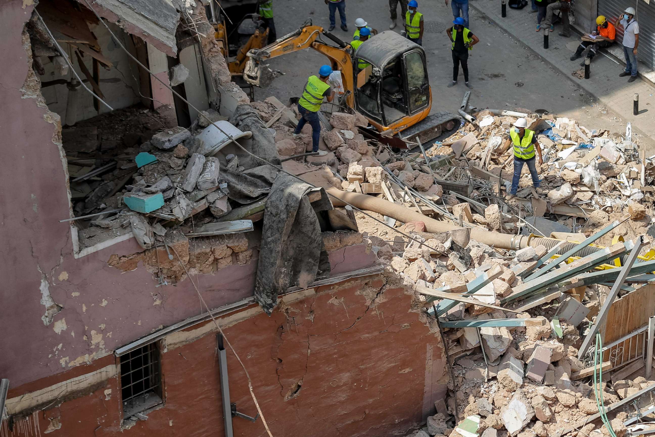 PHOTO: Rescuers search at the site of a collapsed building after getting signals there may be a survivor under the rubble, in Beirut, Lebanon, Saturday, Sept. 5, 2020. 