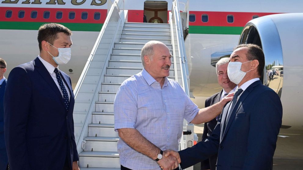 PHOTO: Belarusian President Alexander Lukashenko greets officials during a welcoming ceremony upon his arrival at an airport in Sochi, Russia September 14, 2020.