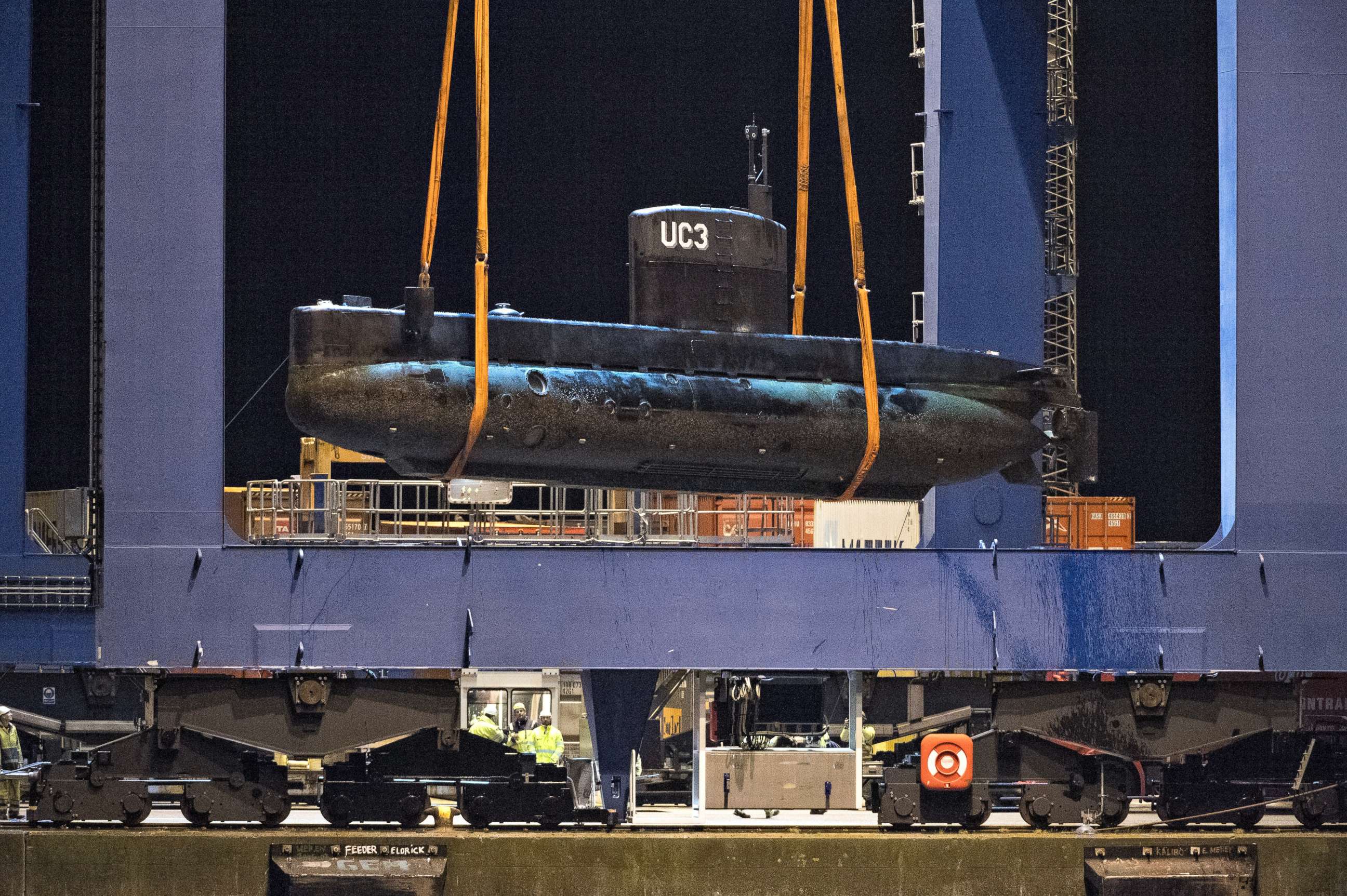 PHOTO: The submarine UC3 Nautilus is lifted onto a block truck from the salvage ship Vina with the help of a container crane in Copenhagen's Harbor, Denmark,August 12, 2013.