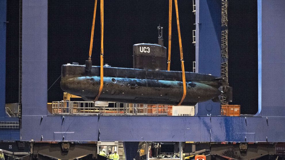 The submarine UC3 Nautilus is lifted onto a block truck from the salvage ship Vina with the help of a container crane in Copenhagen's Harbor, Denmark,August 12, 2013.