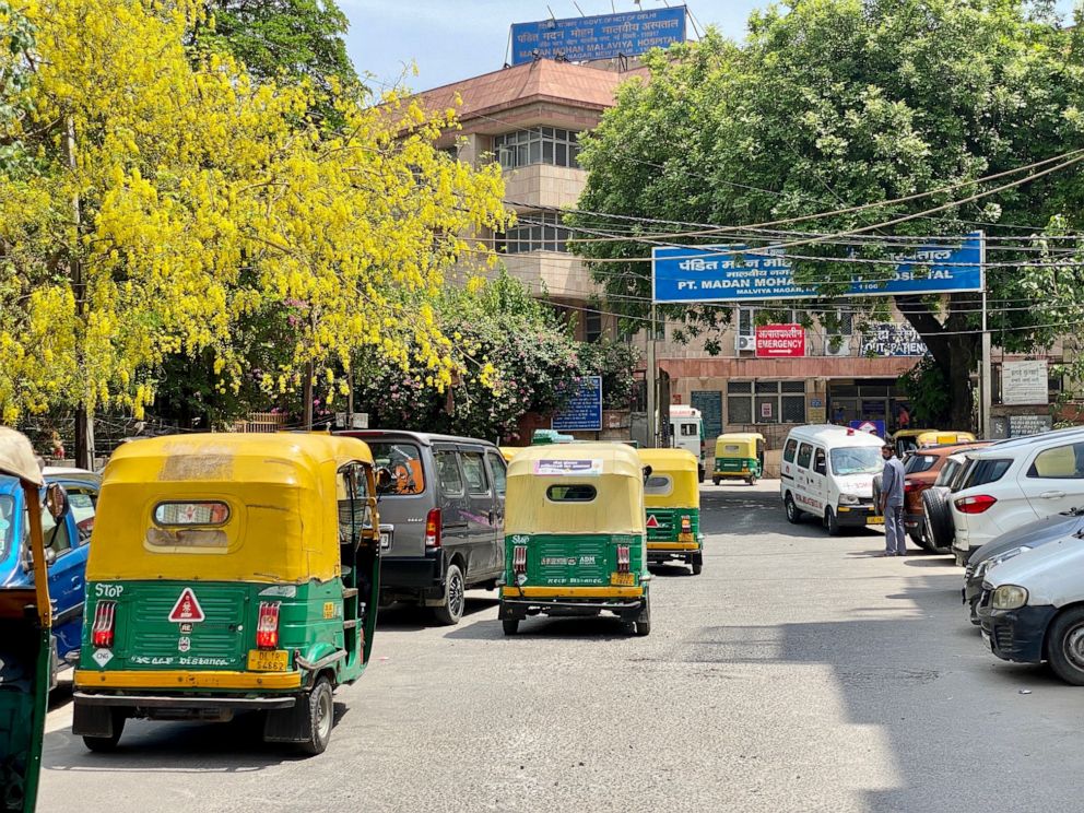 PHOTO: A line of auto-rickshaws sits outside a busy hospital in New Delhi.