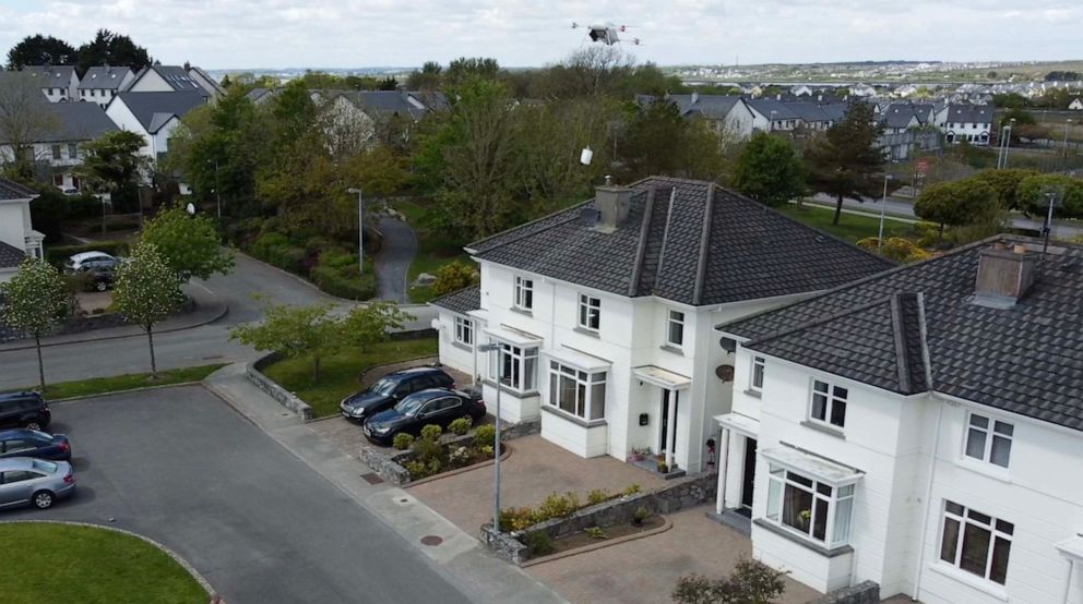 PHOTO: Manna drone lowering a paper bag with groceries by rope during a delivery to a house in Oranmore.