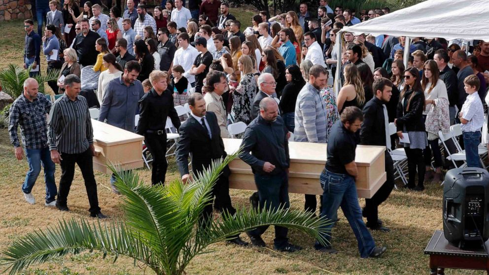 PHOTO: Men carry the caskets of Dawna Ray Langford, 43, and her sons Trevor, 11, and Rogan, 2, who were killed by drug cartel gunmen, during their funeral at the cemetery in La Mora, Sonora state, Mexico, Nov. 7, 2019. 