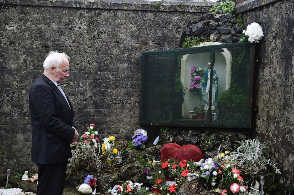 PHOTO: TUAM, IRELAND - JANUARY 13: Tuam Mother and Baby home survivor, Walter Francis pays his respects at the shrine which stands on a mass burial site which was formerly part of the Bon Secours Mother and Baby home on January 13, 2021 in Tuam, Ireland.