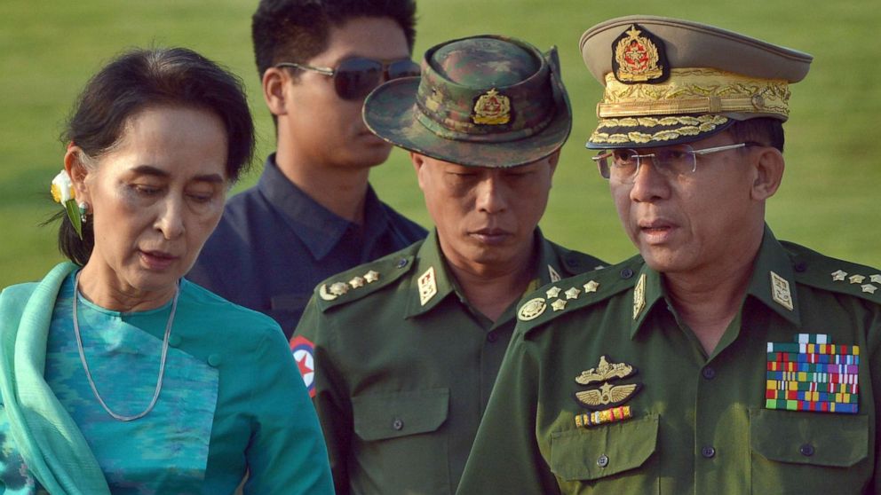 PHOTO: FILE - In this May 6, 2016, file photo, Aung San Suu Kyi, left, Myanmar's foreign minister, walks with senior General Min Aung Hlaing, right, Myanmar military's commander-in-chief, in Naypyitaw, Myanmar. 
