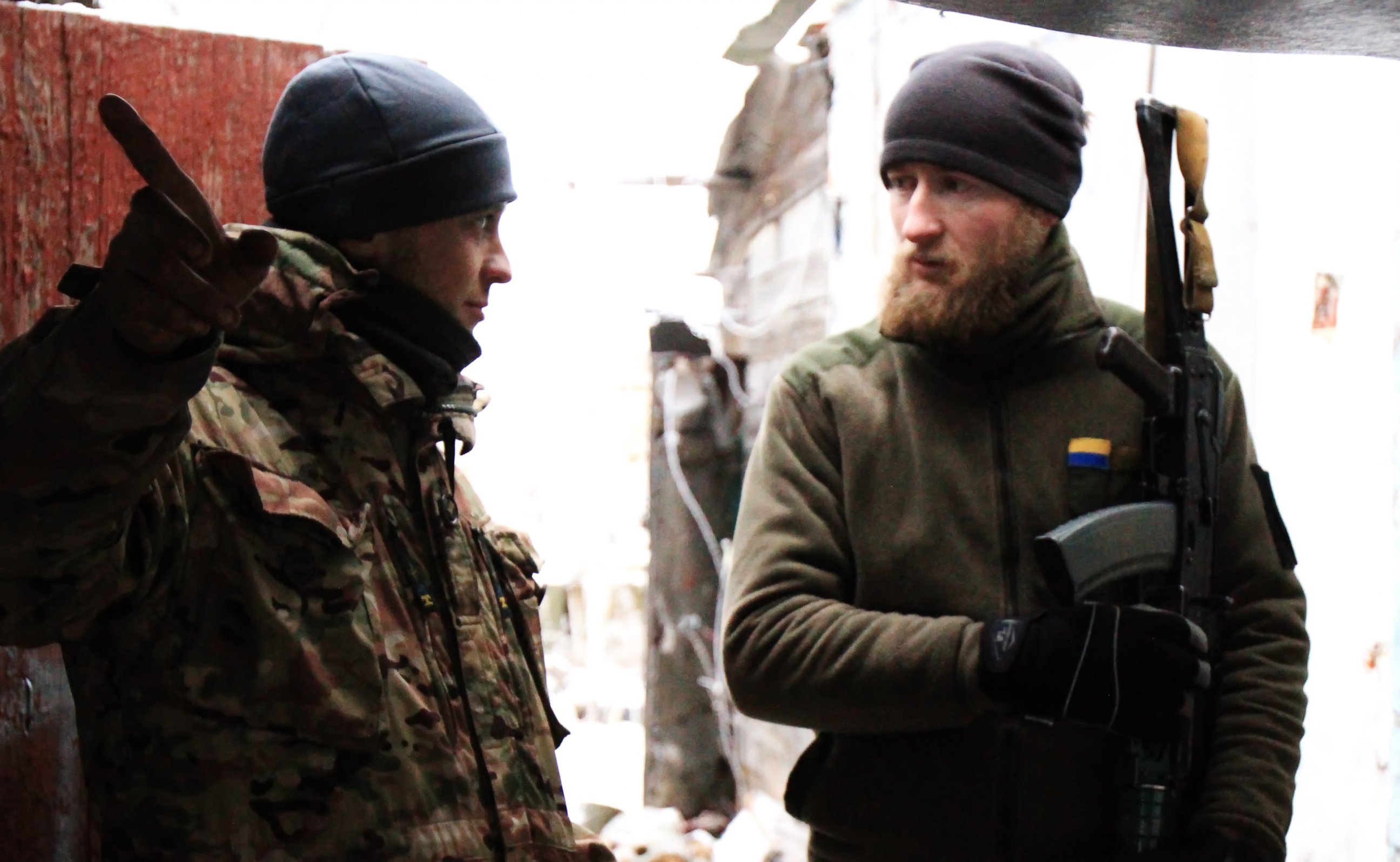 PHOTO: Two Ukrainian soldiers chat in a watch house of Marinka, Donetsk region, Ukraine, Dec. 24, 2016.