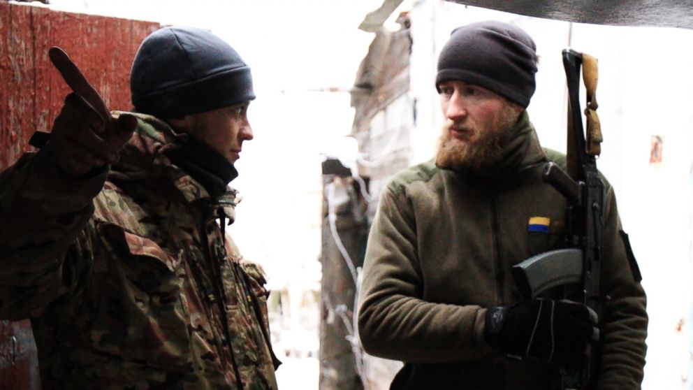 PHOTO: Two Ukrainian soldiers chat in a watch house of Marinka, Donetsk region, Ukraine, Dec. 24, 2016.