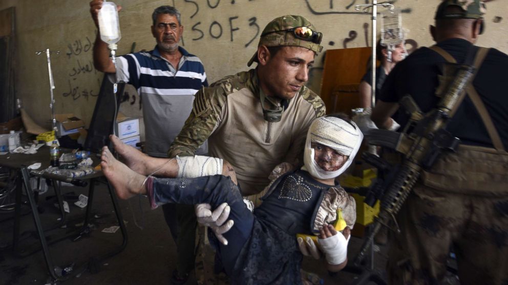 A team from Global Response Management provide emergency medical care at a stabilization point near the Old City, July 2, 2017, in Mosul, Iraq.