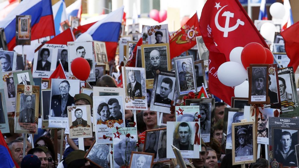 PHOTO: People hold portraits of their relatives who fought in World War II during the Immortal Regiment march in Red Square in Moscow, May 9, 2016.  