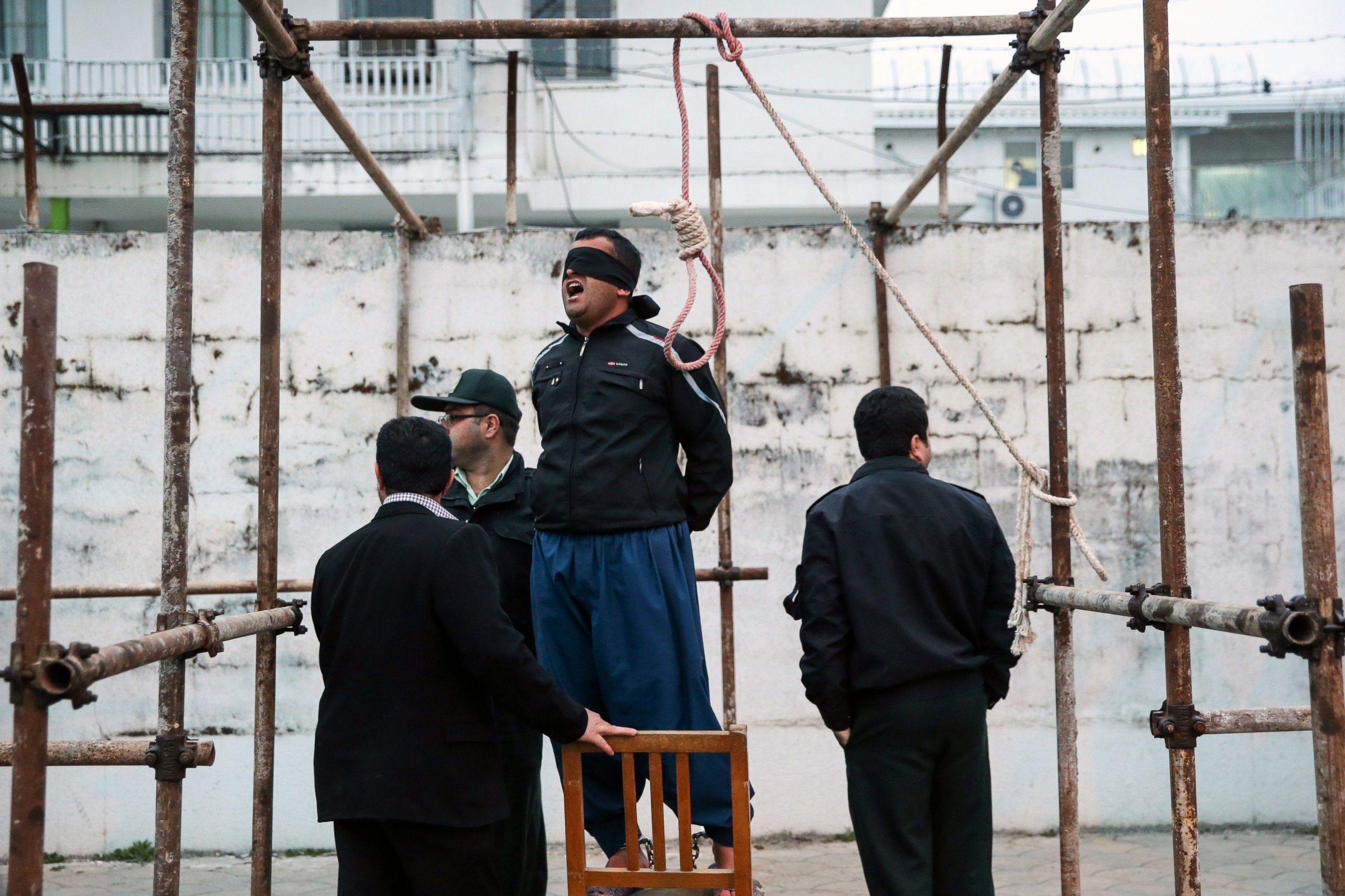 PHOTO: Balal, who killed Abdolah Hosseinzadeh in a street fight with a knife in 2007, reacts as he stands in the gallows during his execution ceremony in Nowshahr, Iran, April 15, 2014. 