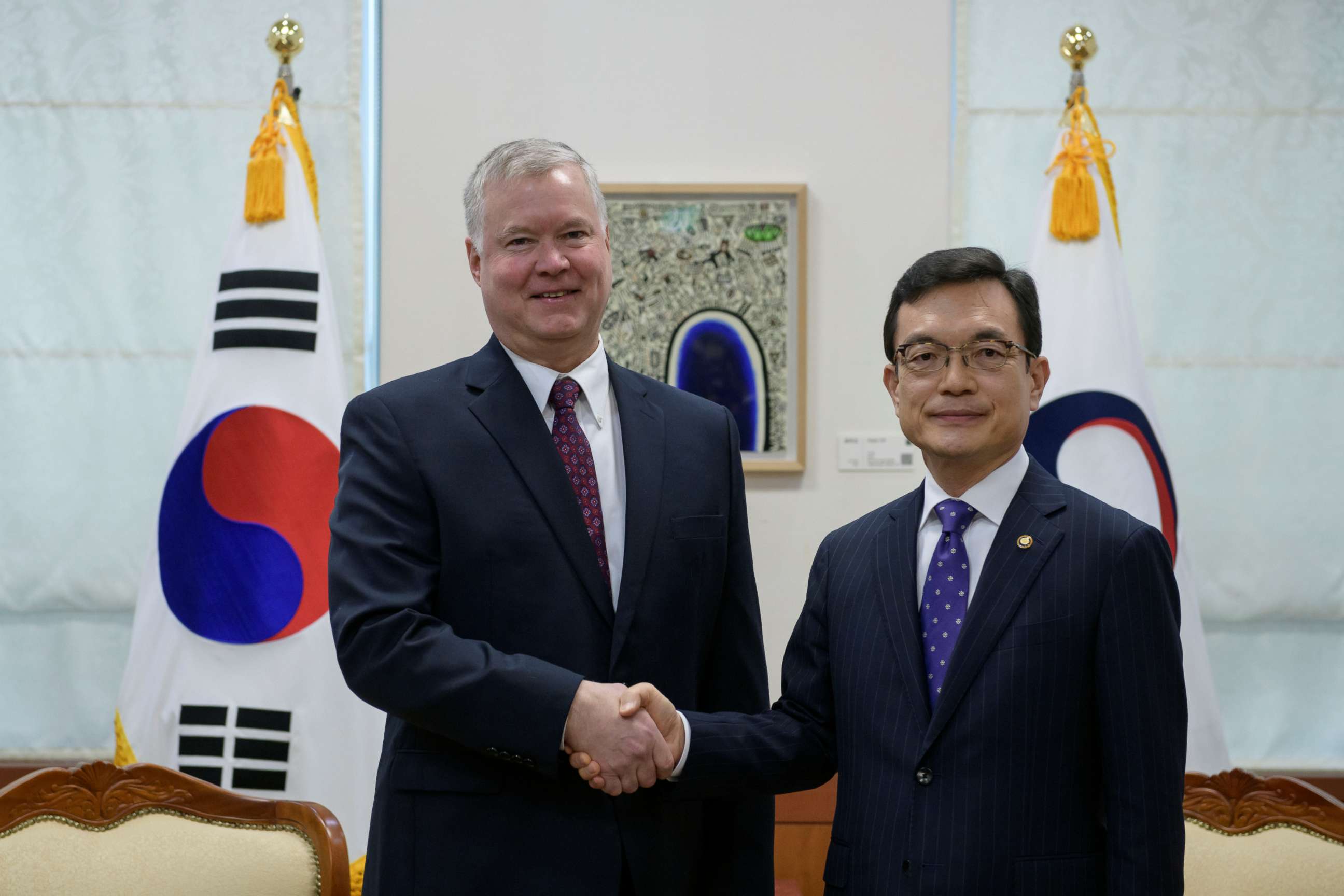 PHOTO: US special representative for North Korea Stephen Biegun (L) shakes hands with with South Korea's vice foreign minister Cho Sei-young (R) at the foreign ministry in Seoul, South Korea December 16, 2019.  Ed Jones/Pool via REUTERS