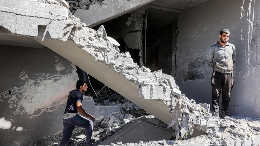 PHOTO: A man climbs a destroyed stairwell following Israeli bombardment in the Zarqa neighborhood in the north of Gaza City on Oct. 26, 2024.