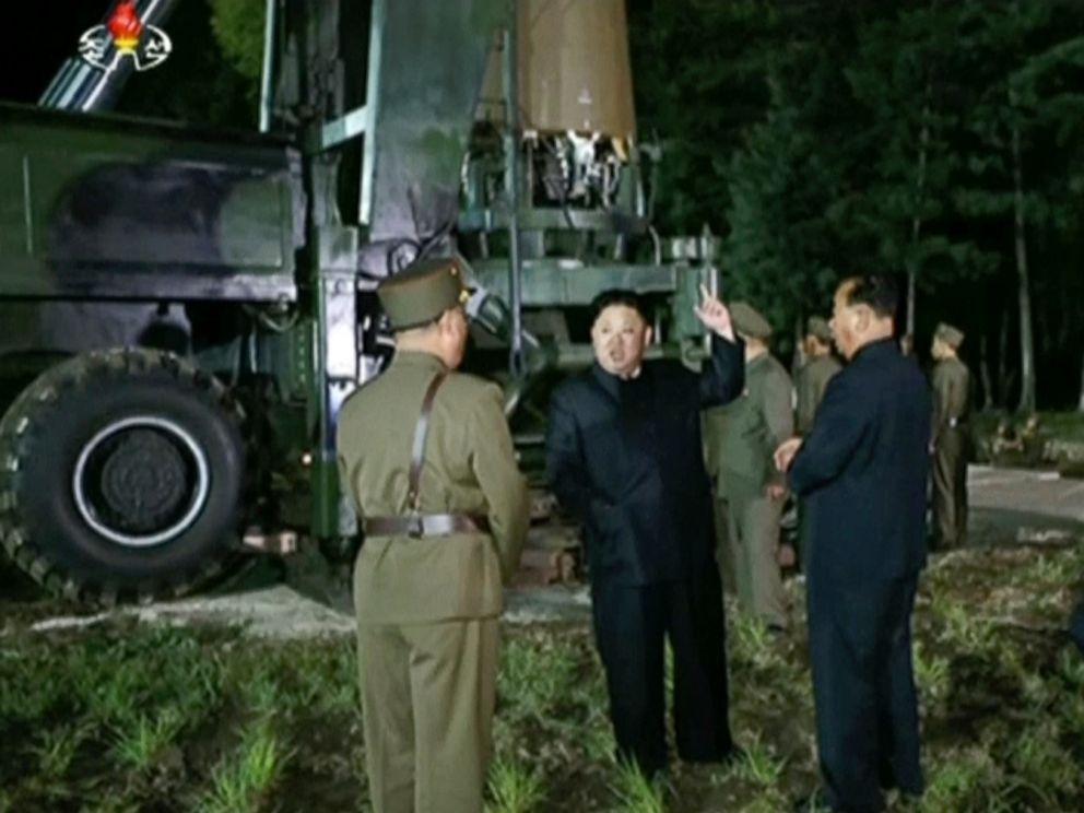 PHOTO: In this image made from video by North Korea's KRT on Friday, July 28, 2017, North Korean leader Kim Jung Un, center, gestures at the site of a missile test at an undisclosed location in North Korea.