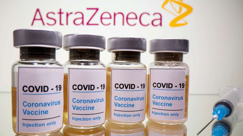 FILE PHOTO: Vials with a sticker reading, "COVID-19 / Coronavirus vaccine / Injection only" and a medical syringe are seen in front of a displayed AstraZeneca logo in this illustration taken October 31, 2020. 