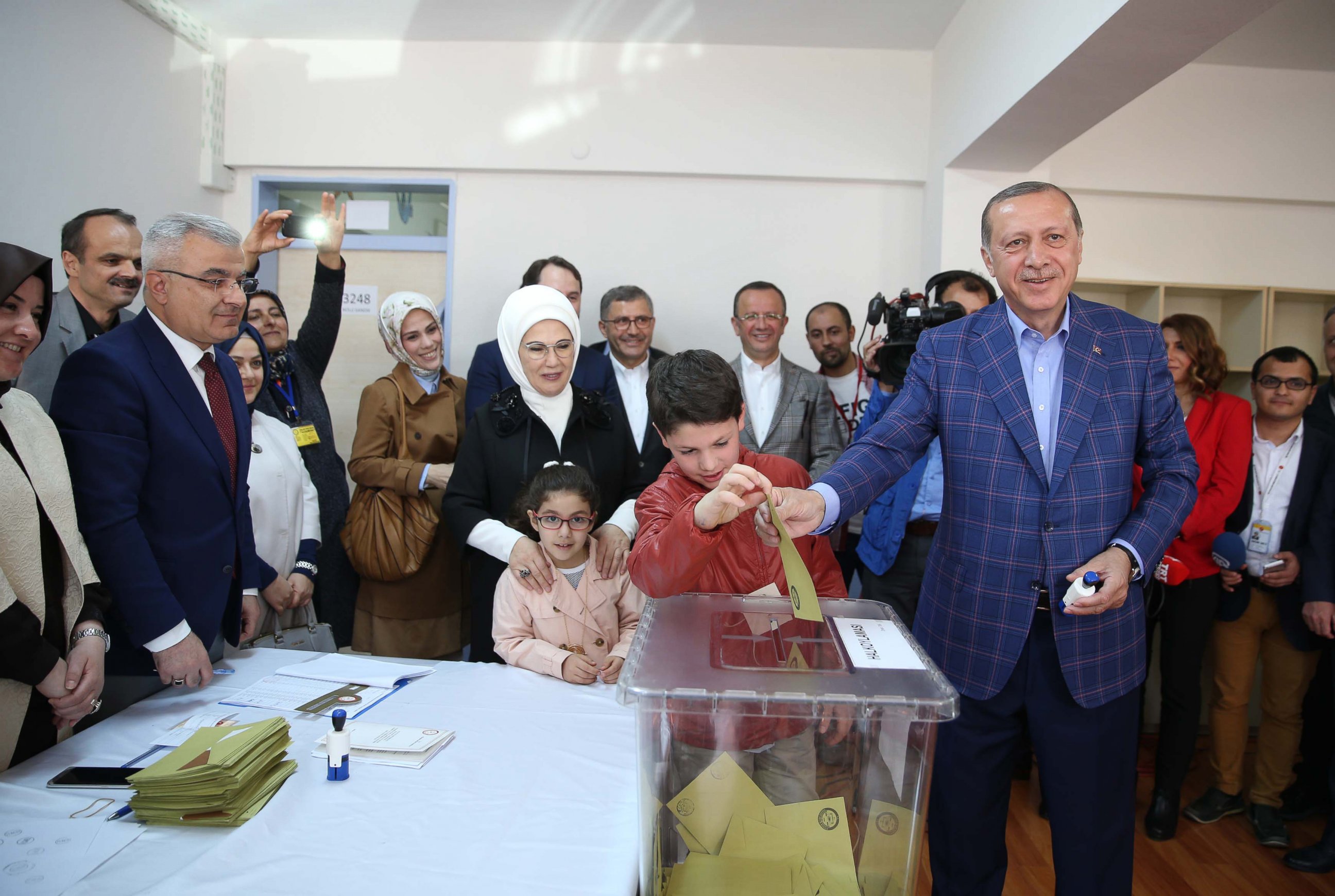 PHOTO: Turkish President Recep Tayyip Erdogan, right, casts his ballot in the country's referendum to allow for the expansion of executive powers at a polling station, April 16, 2017, in Istanbul.