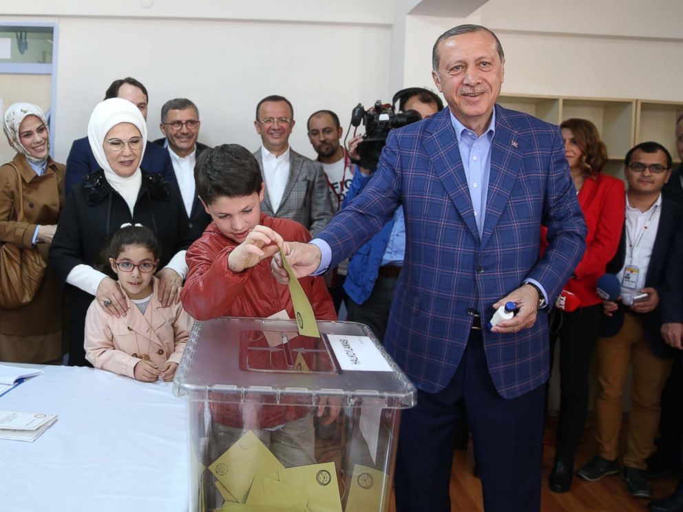 PHOTO: Turkish President Recep Tayyip Erdogan, right, casts his ballot in the countrys referendum to allow for the expansion of executive powers at a polling station, April 16, 2017, in Istanbul.