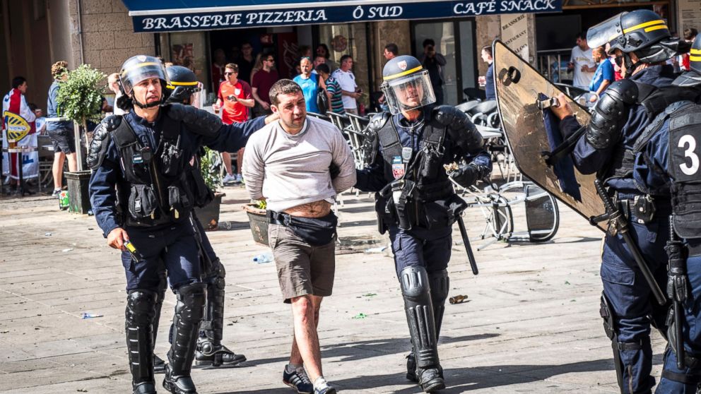 PHOTO: English supporters are arrested after they clash with riot police in the city of Marseille, France, June 11, 2016, before the UEFA EURO 2016 group B preliminary round match between England and Russia.