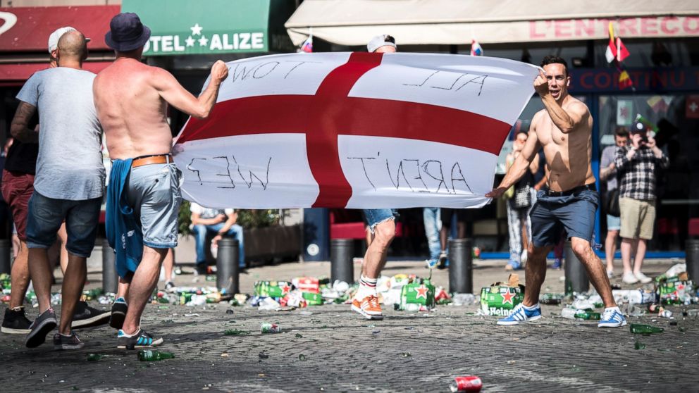 PHOTO: English supporters throw glass bottles as they clash with riot police at the Old Port of Marseille, France, June 11, 2016, before the UEFA EURO 2016 group B preliminary round match between England and Russia.