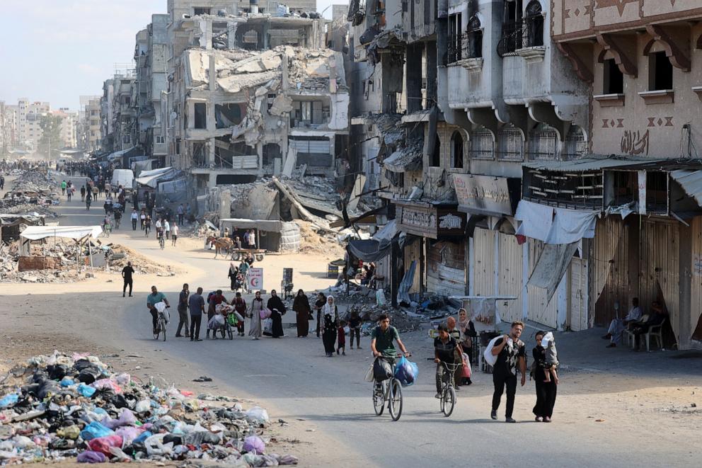 PHOTO: Palestinians carry their belongings as they flee areas north of Gaza City in the northern Gaza Strip on Oct. 12, 2024.