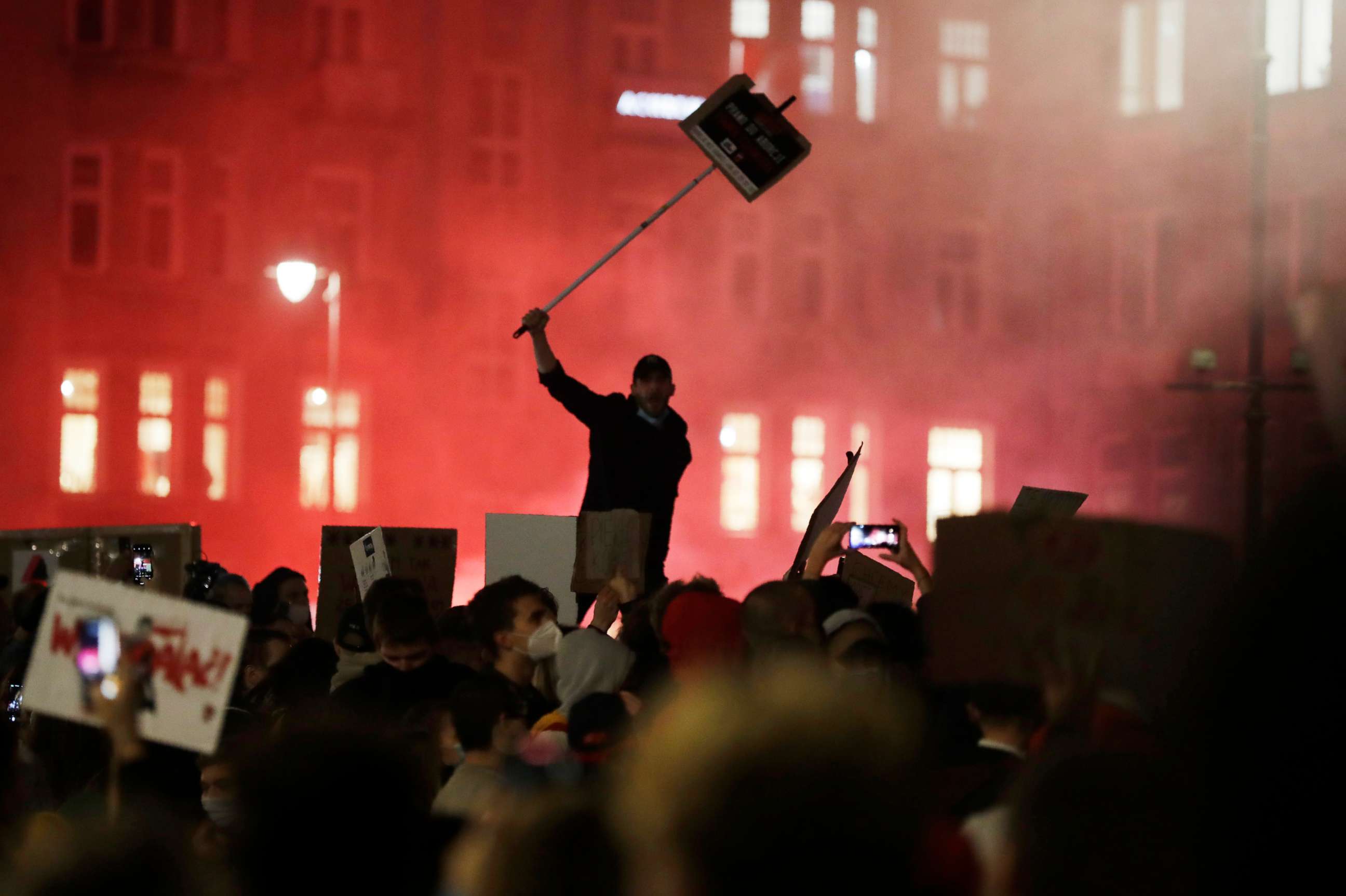 PHOTO: A protester with a sign of the women's rights campaign joins others on the fifth day of nationwide protests against recent court ruling that tightened Poland's restrictive abortion law, in Warsaw, Poland, on Monday, Oct. 26, 2020. 