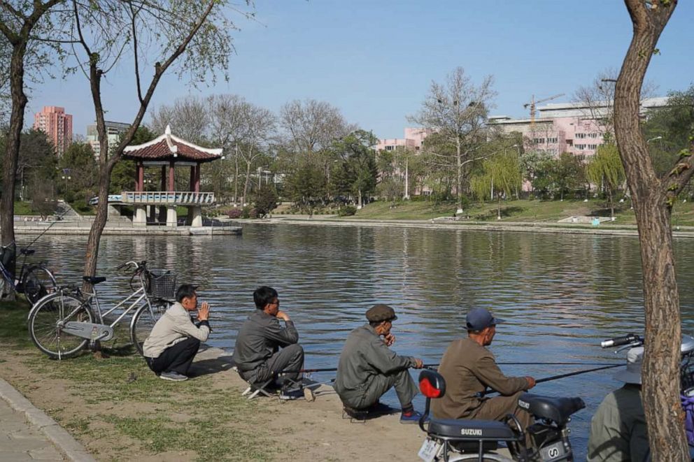 PHOTO: Locals fish in the Potong River, Pyongyang, North Korea, April 21, 2018.