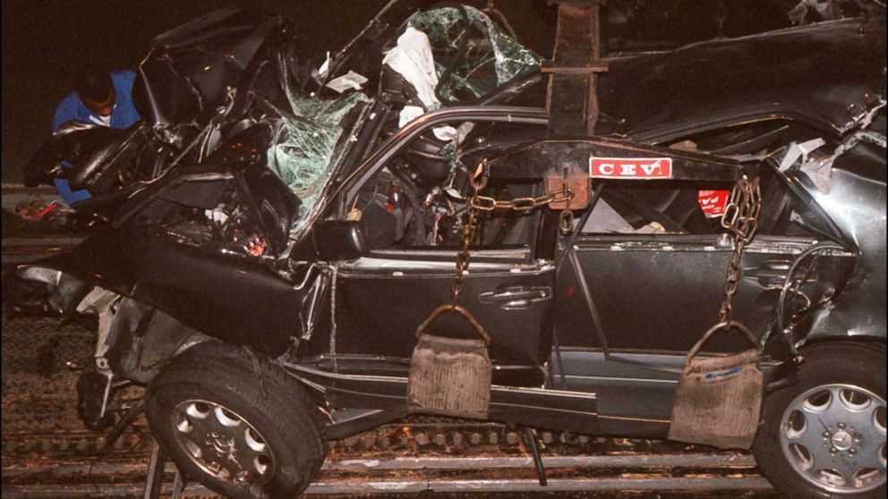 PHOTO: Emergency crews work on the wreckage of Princess Diana's car in the Alma tunnel of Paris.