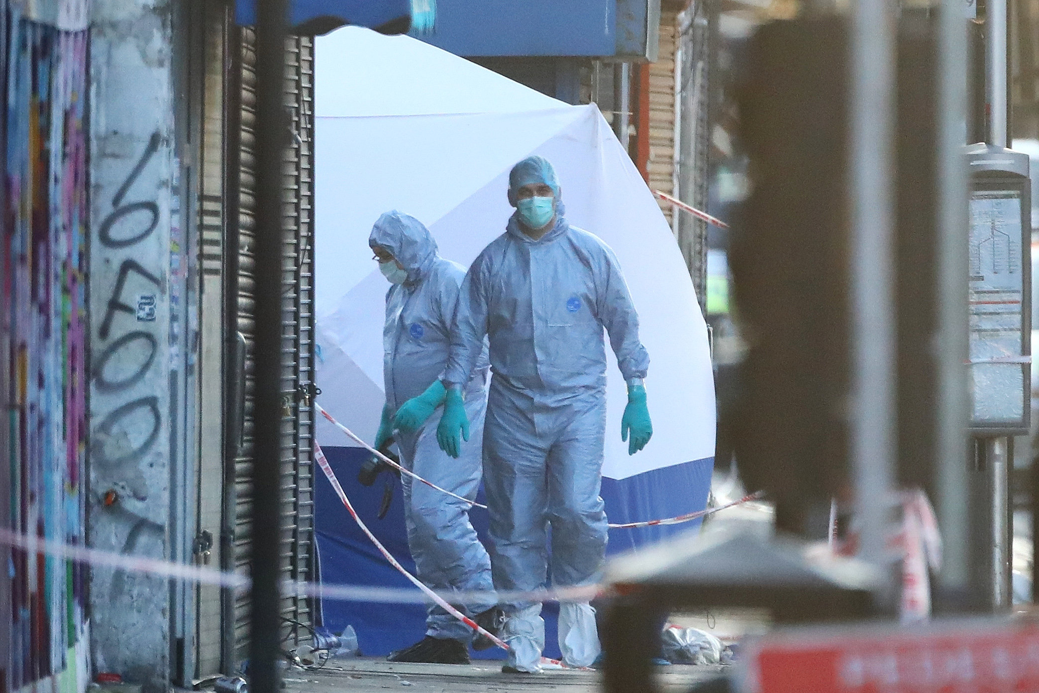 PHOTO: Forensic and police officers attend to the scene after a vehicle collided with pedestrians in the Finsbury Park neighborhood of North London, June 19, 2017.