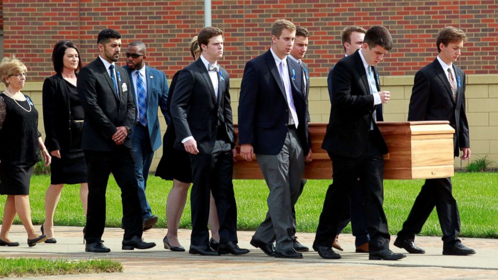PHOTO: Otto Warmbier's casket is carried to the hearse followed by his family and friends after a funeral service for Warmbier, who died after his release from North Korea detention in a coma, at Wyoming High School in Wyoming, Ohio, June 22, 2017.  
