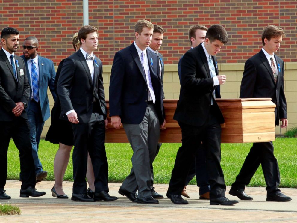 PHOTO: Otto Warmbiers casket is carried to the hearse followed by his family and friends after a funeral service for Warmbier, who died after his release from North Korea detention in a coma, at Wyoming High School in Wyoming, Ohio, June 22, 2017.