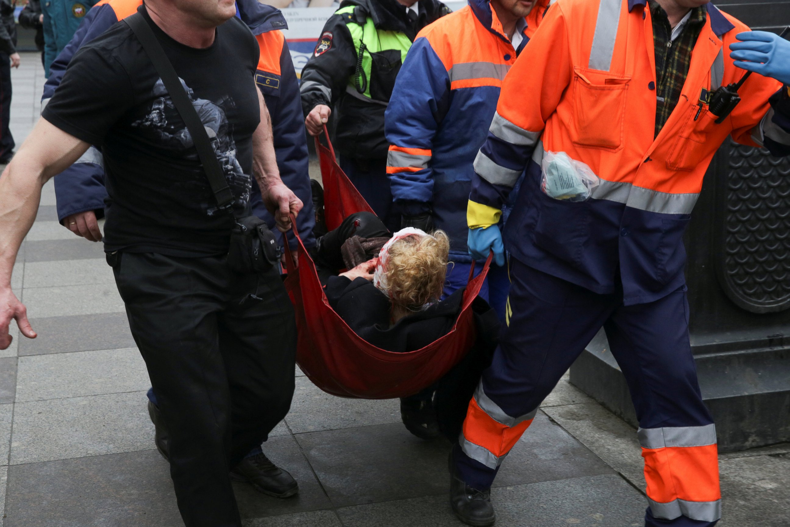 PHOTO: An injured person is helped by emergency services outside Sennaya Ploshchad metro station, following explosions in two train carriages at metro stations in St. Petersburg, Russia, April 3, 2017. 