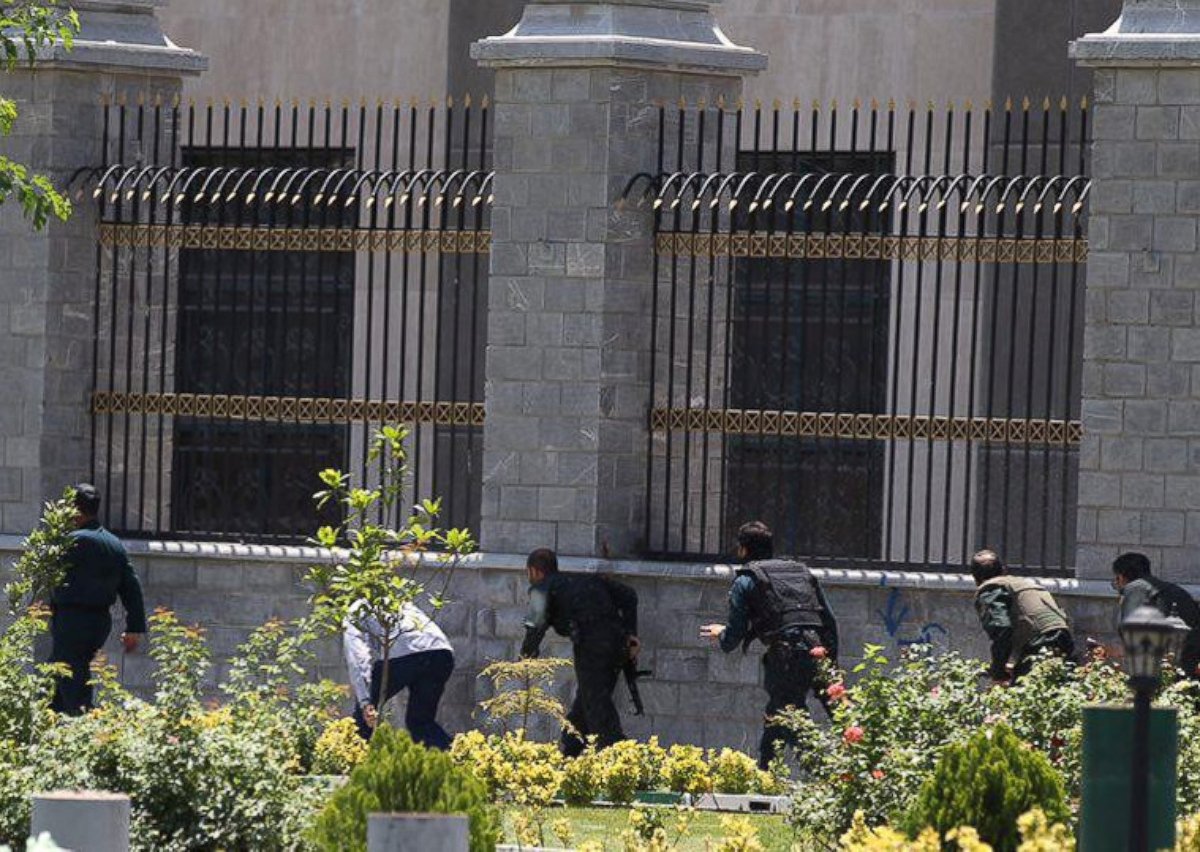 PHOTO: Members of Iranian forces run during an attack on the Iranian parliament in central Tehran, Iran, June 7, 2017.