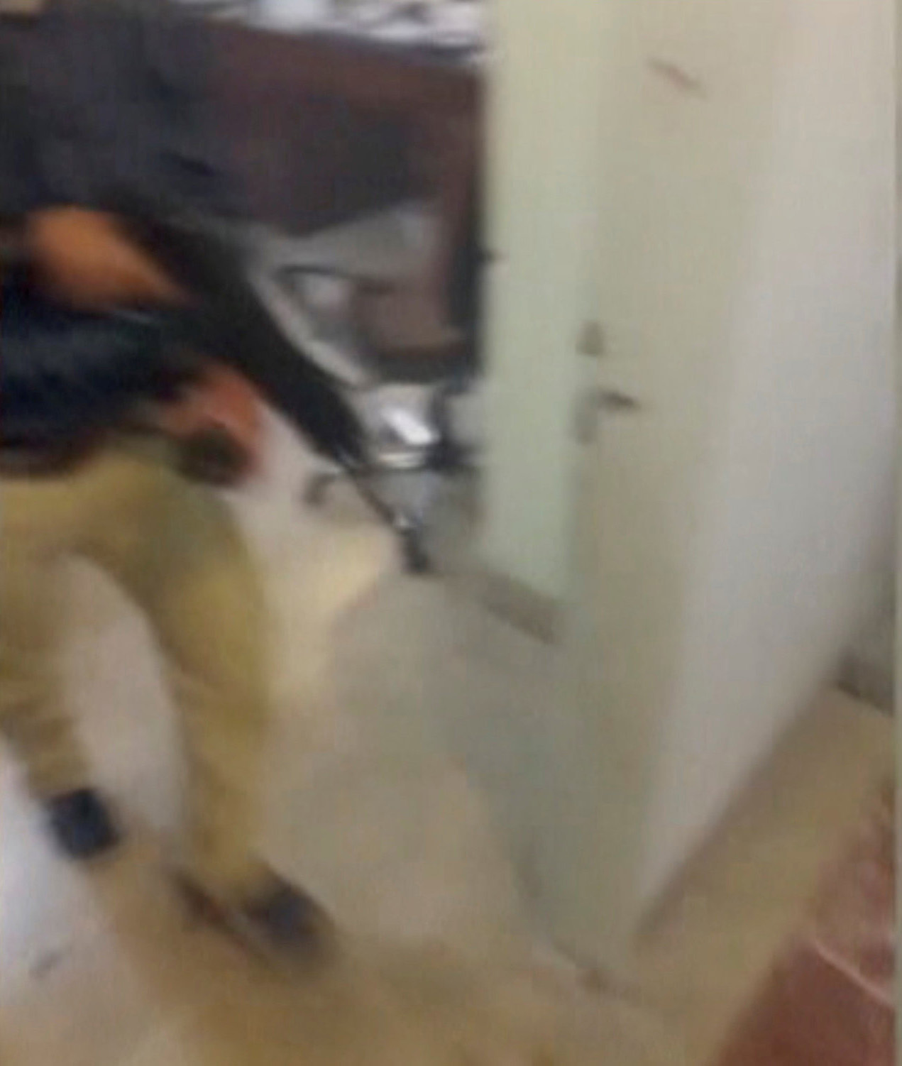 PHOTO: A still image taken from a video released on the internet by ISIS, June 7, 2017, claims to show a man with a gun walking into an office said to be inside Iranian parliament in Tehran, Iran.