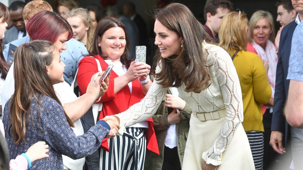 Britain's Catherine, Duchess of Cambridge talks to children at a tea party at Buckingham Palace in London, May 13, 2017. 