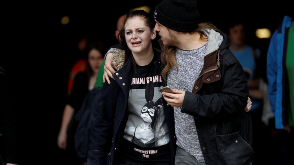People rush out of the Arndale shopping centre as it is evacuated in Manchester, Britain, May 23, 2017.