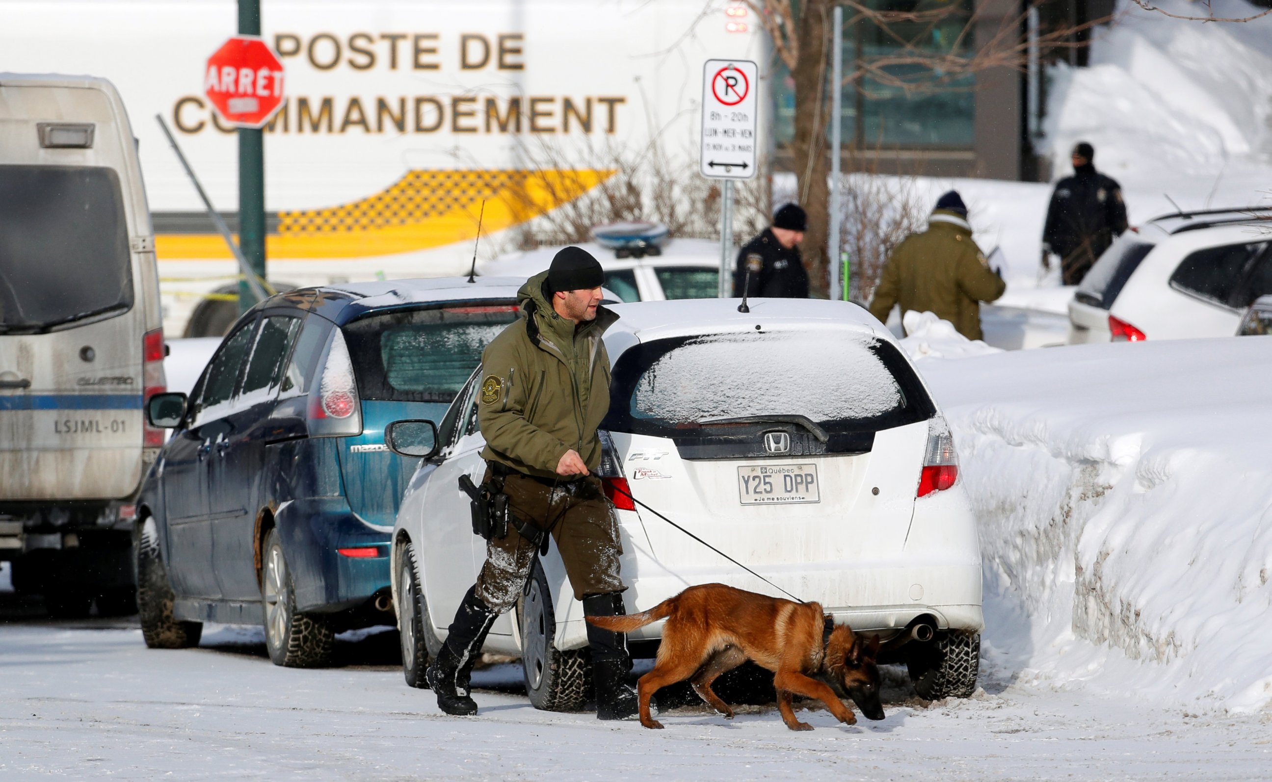 PHOTO: Police officers patrol the perimeter at the scene of a fatal shooting at the Quebec Islamic Cultural Centre in Quebec City, Canada, Jan. 30, 2017. 