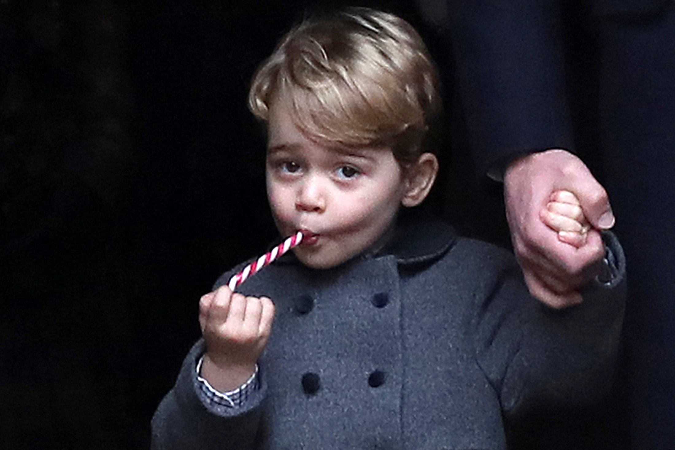 PHOTO: Prince George, the son of the Duke and Duchess of Cambridge, sucks a sweet as he leaves following the morning Christmas Day service at St Mark's Church in Englefield, near Bucklebury in southern England, Dec. 25, 2016. 