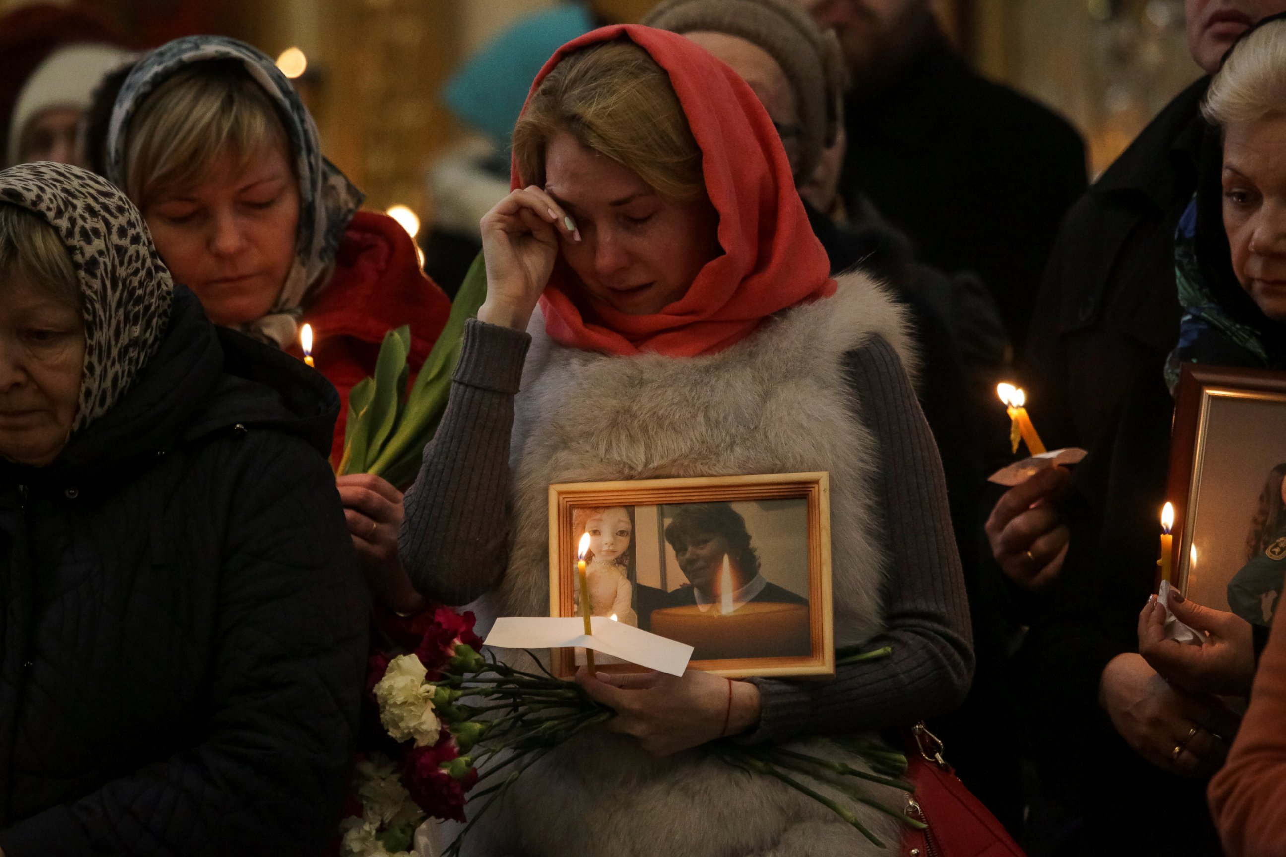 PHOTO: Relatives of victims of the Monday's metro bombing attend a memorial service at the Trinity Cathedral in St. Petersburg, Russia, April 5, 2017. 