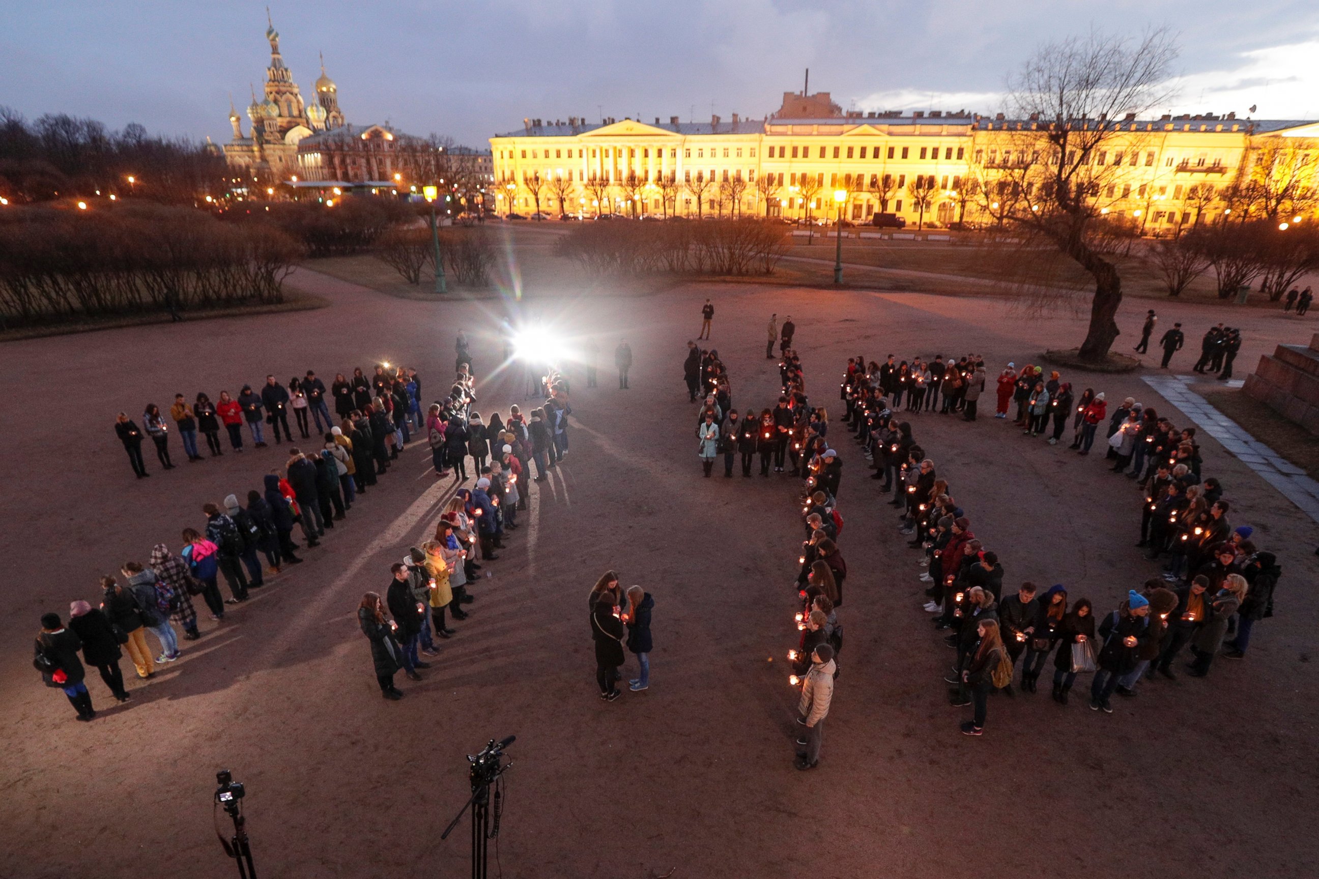 PHOTO: People form digits of the time of the subway bombing in memory of victims of the tragic event, on Marsovo Polye in St.Petersburg, Russia, April 5, 2017.