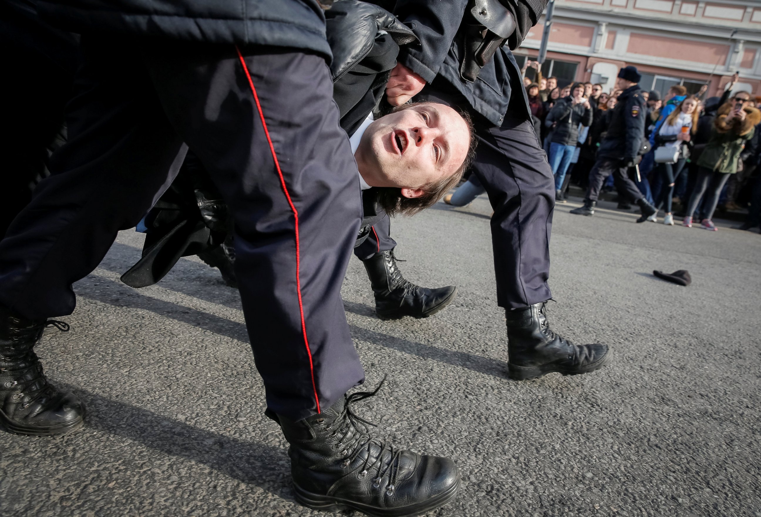 PHOTO: Law enforcement officers detain an opposition supporter during a rally in Moscow, Russia, March 26, 2017.