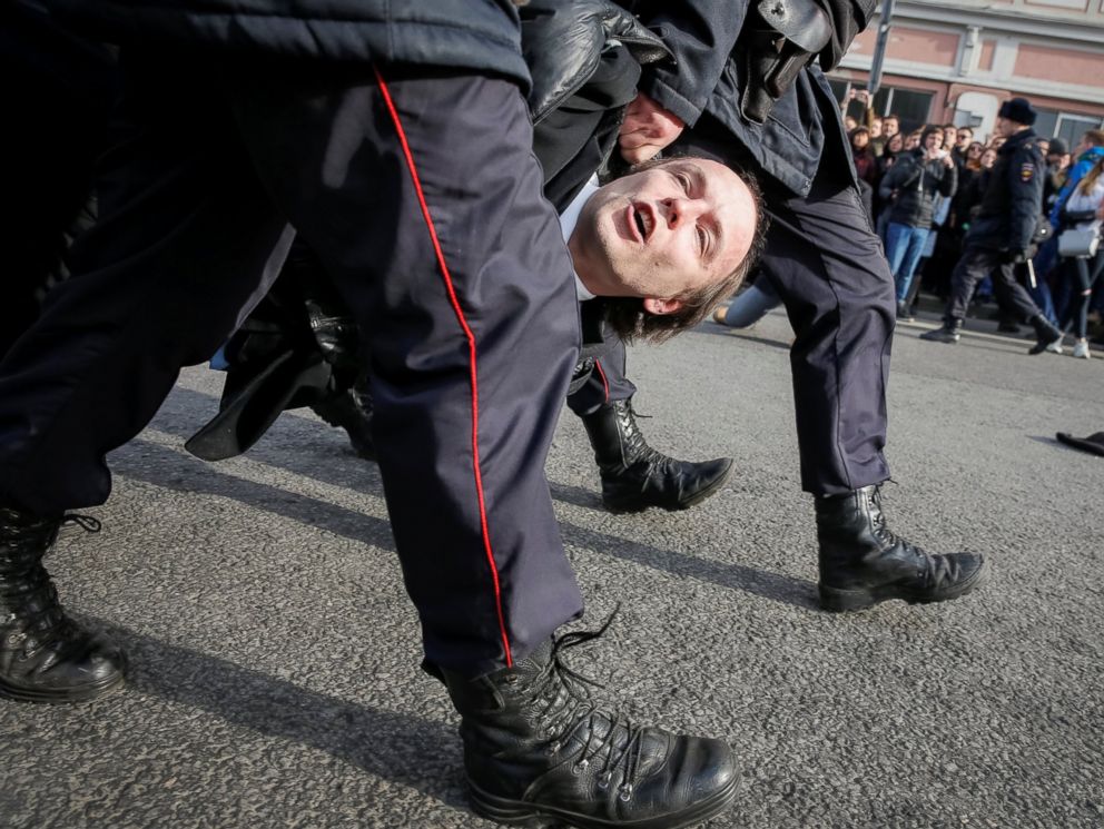 PHOTO: Law enforcement officers detain an opposition supporter during a rally in Moscow, Russia, March 26, 2017.